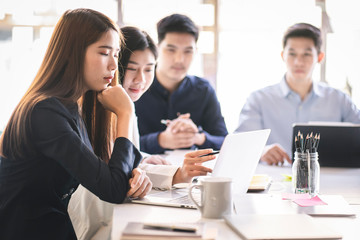 Business team discussing together in conference room during meeting at office. Teamwork, brainstorm and ideas concept. saleperson using tablet and presentation somthing to client.