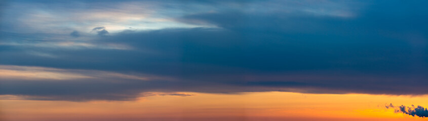 Fantastic dark thunderclouds at sunrise