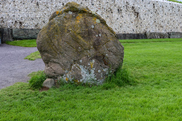 A large weathered megalithic standing stone at Newgrange, Ireland. The dazzling white quartz stone...