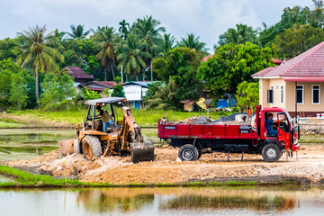 Editorial, Alor Setar, Kedah, Malaysia December 20th 2019. Earthwork and Construction Tractor Busy Working