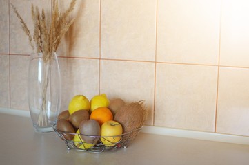 A bowl of different fruits on the table. Eating fruits prevents from diseases.