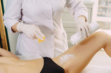 waxing in the cabin. girl master makes hair removal. shugaring