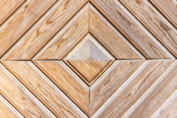 Wooden door texture. Decorative wood design pattern. Square frame architecture background. Geometric carpentry wall. 