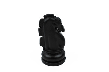 Black color knight pawn placed in a middle of the white isolated background