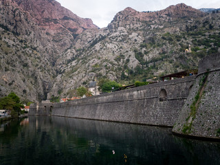 View of the walls of the old city of Kotor from the promenade. Montenegro autumn 2019