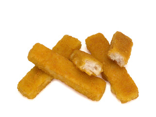 Fish fingers made of fish fillet on white background