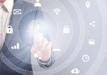 Business man in suit pressing button on infographic panel