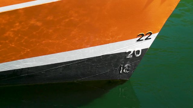 Boat on the water with light reflections