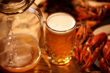 Crayfish with beer on a wooden table
