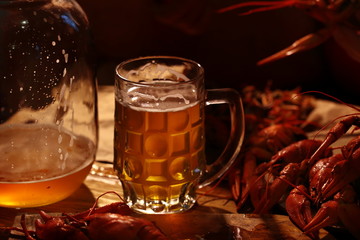 Crayfish with beer on a wooden table
