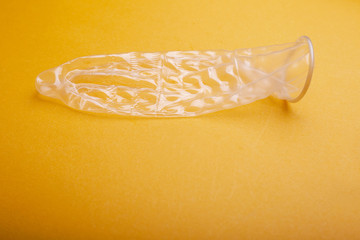 Condom on a yellow background