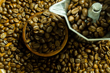 Roasted Coffee beans on grunge wooden can be used as a background