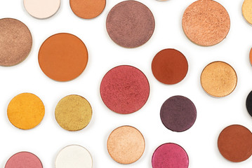 Round multicolored make up eyeshadows isolated on white.