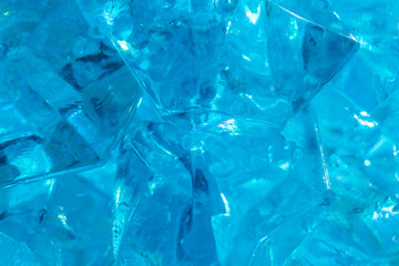 Abstract glass texture. A network of cracks on a piece of classic blue color glass. Can be used as background. Classic blue color