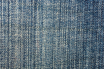 clothing items blue stonewashed faded jeans cotton fabric texture with seams, clasps, buttons and rivets, macro, close-up