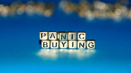 Beads with words "Panic Buying". Selected focus.