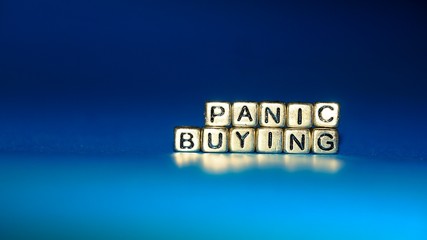 Beads with words "Panic Buying". Selected focus.