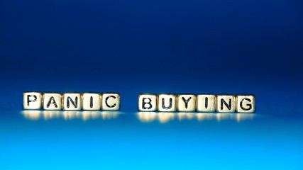 Beads with words "Panic Buying". Selected focus.
