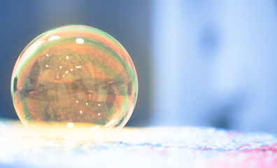 Soap bubbles floating in the air as the Summer sun sets