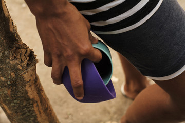 Woman holds a plate and a glass in her hands