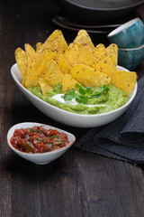 corn chips with pesto and tomato sauce
