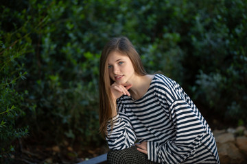 Naklejka premium Beautiful teen girl in a marine striped shirt