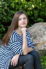 Fototapeta premium Beautiful teen girl in a marine striped shirt