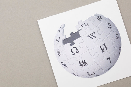 OXFORD, UK - FEB 16 2017: Wikipedia online encyclopedia logo printed on paper