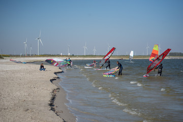 surfers on the water. along the beach of Zeewolde Flevoland Netherlands April 21, 2020