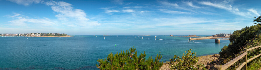 Panoramic seascape view of Saint Malo and Dinard taken from Port des Sablons on a warm summer day
