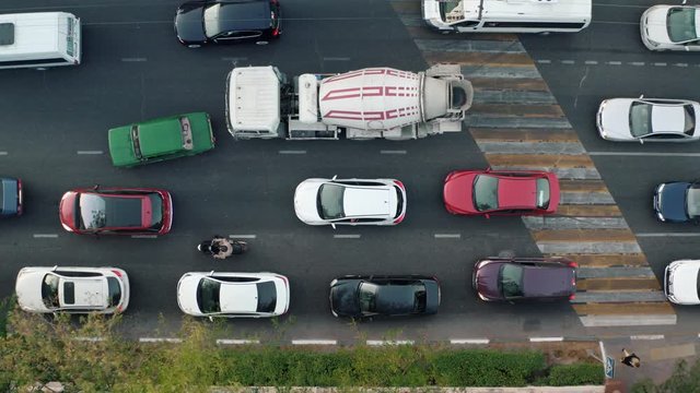 The large number of cars stand on the freeway and honk in a traffic jam