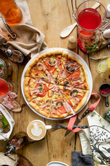 Italian pizza with olive oil and towel on cafe restaurant table top view