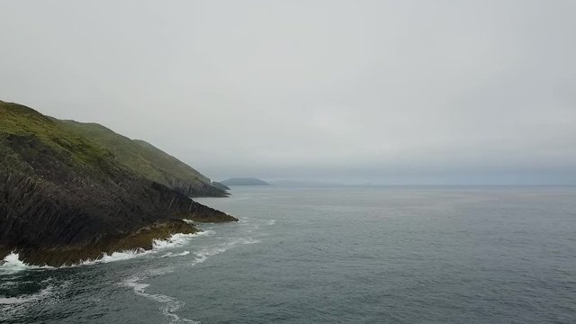 Aerial of misty Irish coastline 