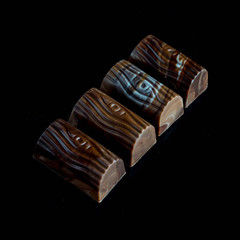 chocolate candies on black stone