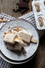 Homemade ice cream pops with peanut butter and chocolate flavor. Summer refreshment, healthy dessert. Close up