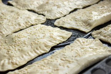 homemade meat patties on the baking sheet