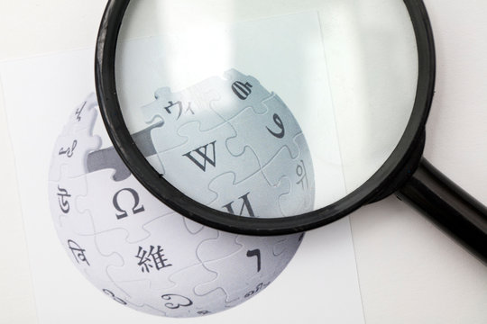 OXFORD, UK - FEB 16 2017: Wikipedia online encyclopedia logo printed on paper