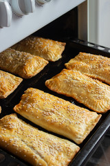 homemade meat patties on the baking sheet