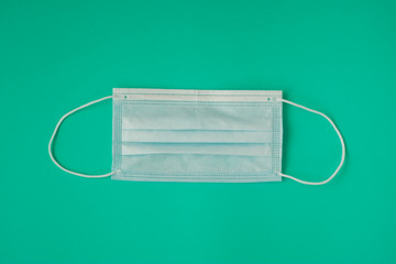 medical mask on green background