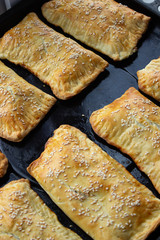homemade meat patties on the baking sheet