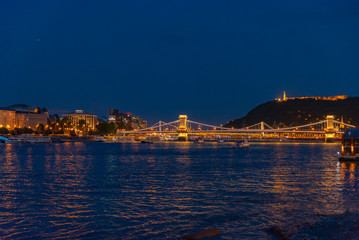 Fototapeta premium sunset over the river in the city of Budapest with the Parliament