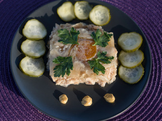jelly on a plate with mustard and pickles