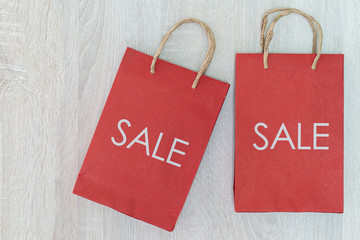 SALE sign on bag: it's time for a shopping spree ,Colorful autumn leaves in colorful paper shopping...
