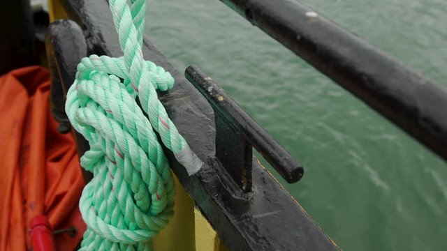 rope tied to the side of a boat