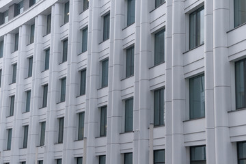Rows of windows of a office building. Minimalist and modern architecture facade in white color