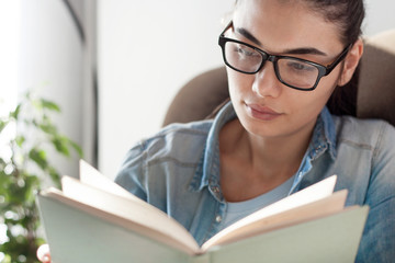 young woman reading a book