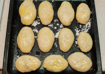 homemade pies not ready on a baking sheet,pies from raw dough oval shape,round pies with sesame seeds,
bake cakes at homemade pies close upme, cook homemade cakes at home,
