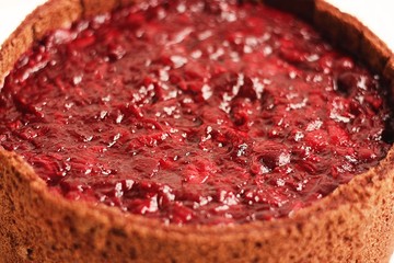 Obraz premium Delicious chocolate cake with cherries jam macro