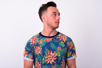 Obraz premium Face of young handsome tourist man thinking and looking away