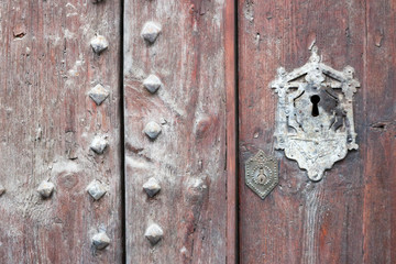 old wooden door with vintage keyhole